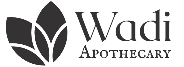 Wadi Apothecary logo with leaf design on a transparent background